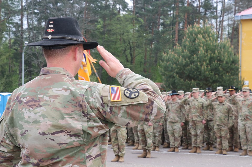 U.S. Army personnel salute during the transfer of authority ceremony of the JMTG-U training mission at the Yavoriv training range on May 2, 2019.