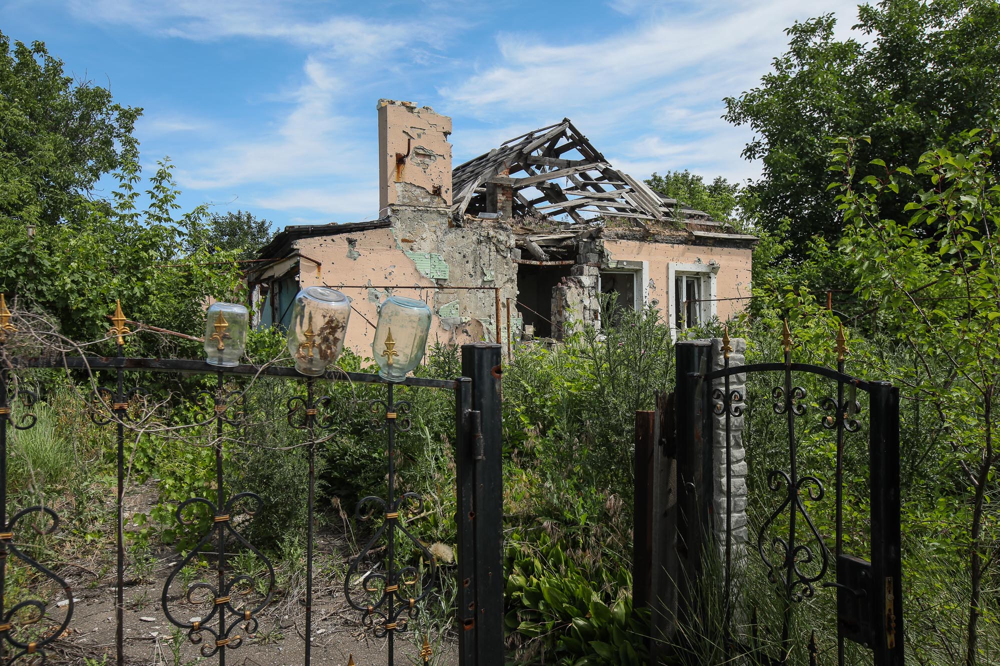 A ruined house in the town of Opytne, pictured on June 12, 2019. 