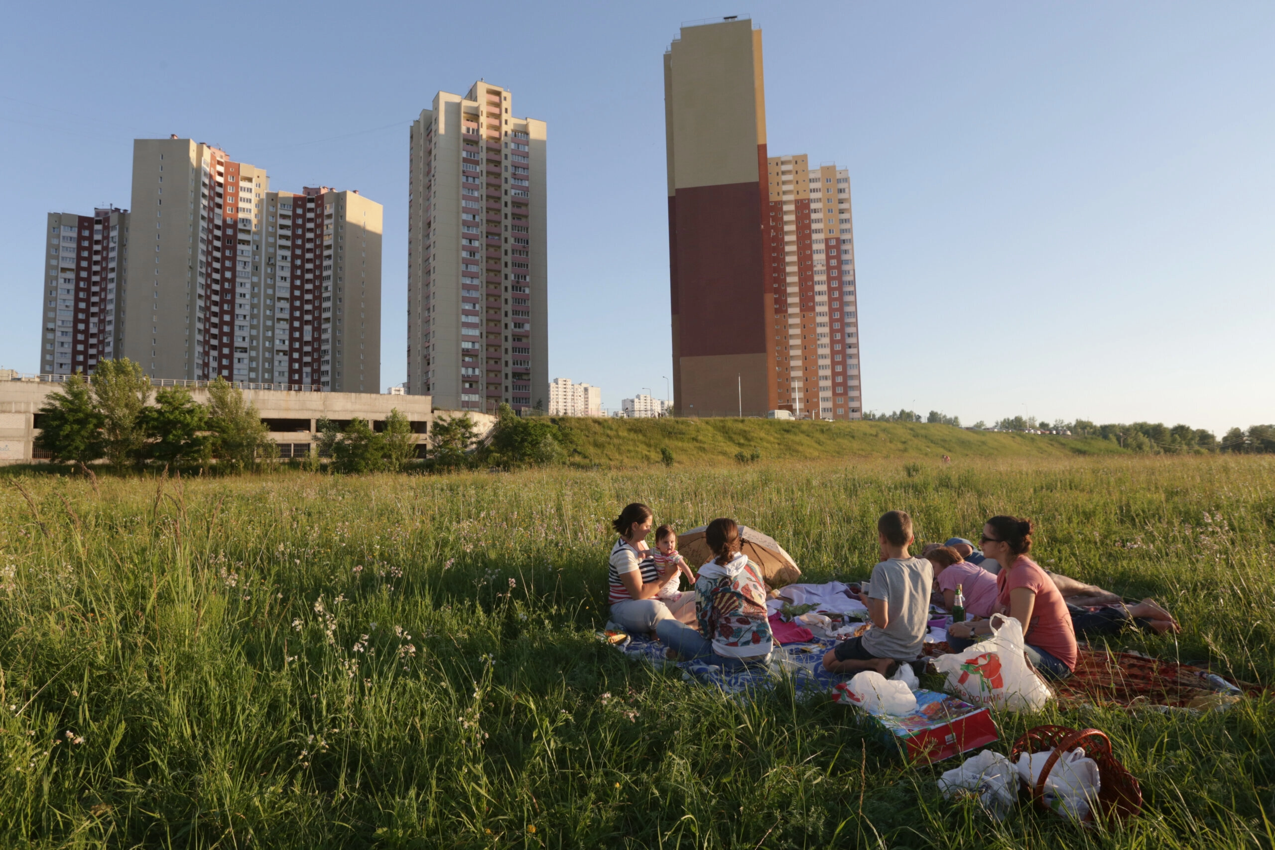 The residents of Kyiv&#8217;s Troieshchyna neighborhood enjoy outdoors on June 11, 2015.