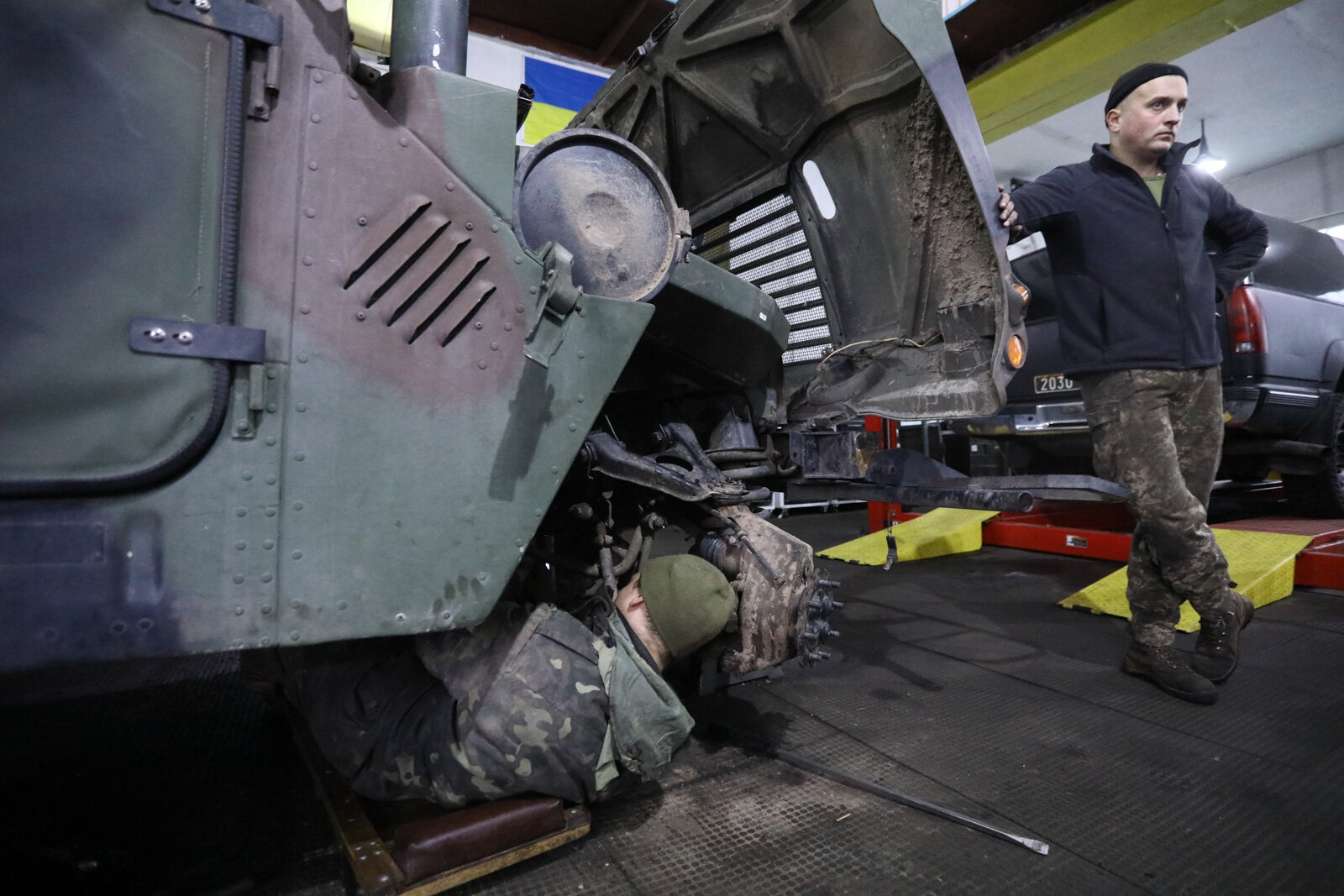 Technicians repair a Humvee vehicle at a Ukrainian army&#8217;s maintenance and overhaul workshop in the city of Zhytomyr on Nov. 20, 2020.
