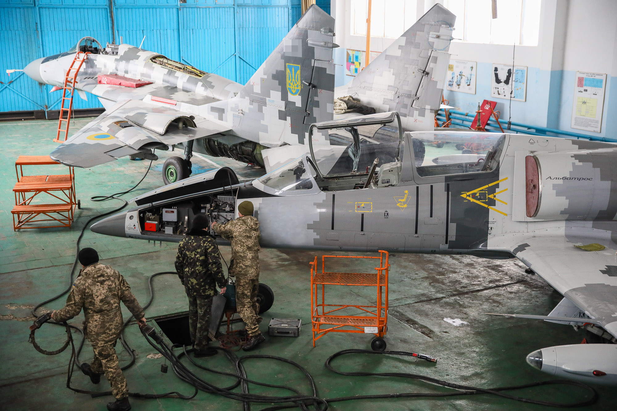 Repair technicians inspect a Ukrainian Air Force&#8217;s L-39 Albatros training plane at an airbase of Vasylkiv on Feb. 14, 2019.