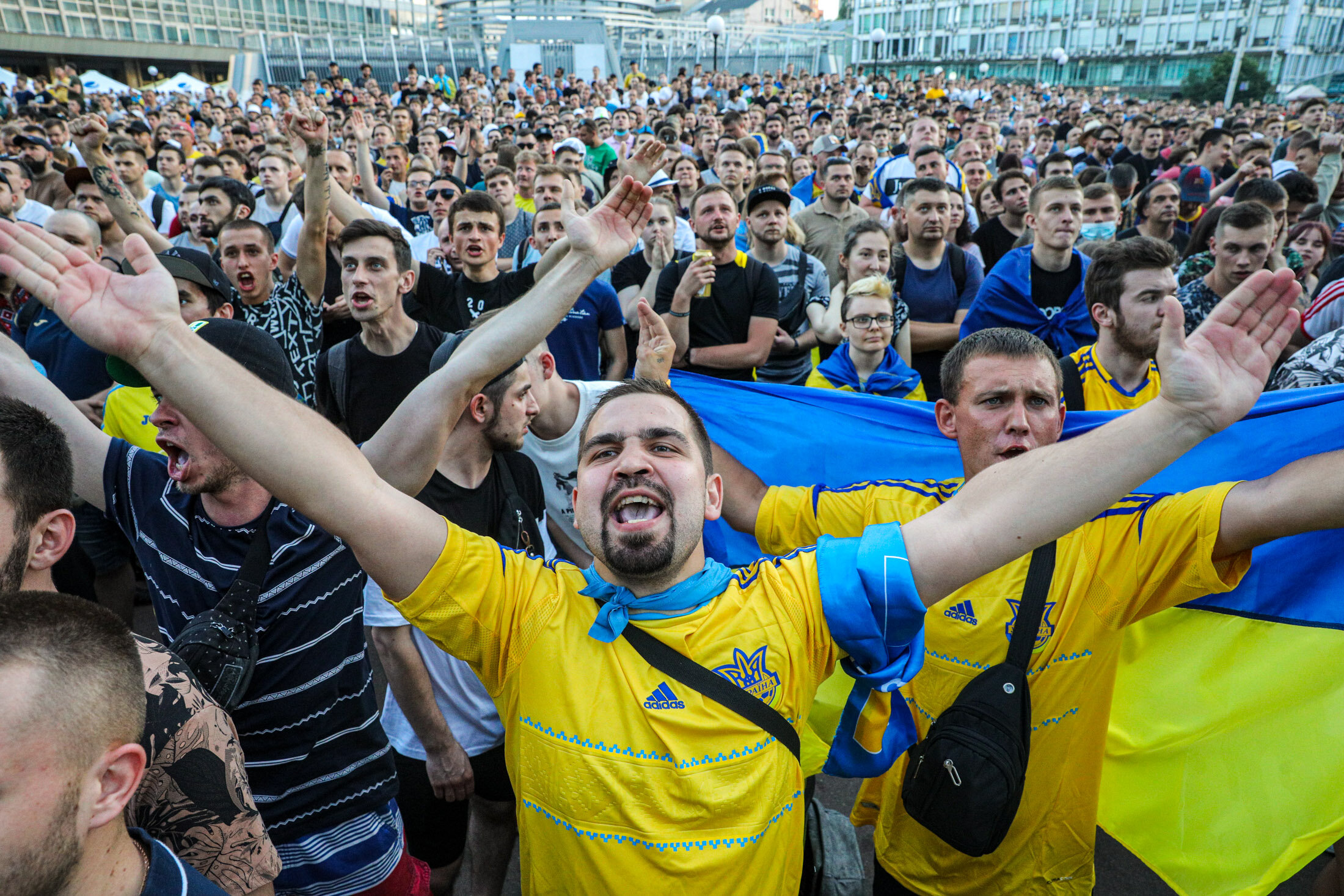 Ukrainian supporters reacts as they watch the  UEFA EURO 2020 Group C football match between Ukraine and Austria on a giant screen in the center of Kyiv on June 21, 2021.