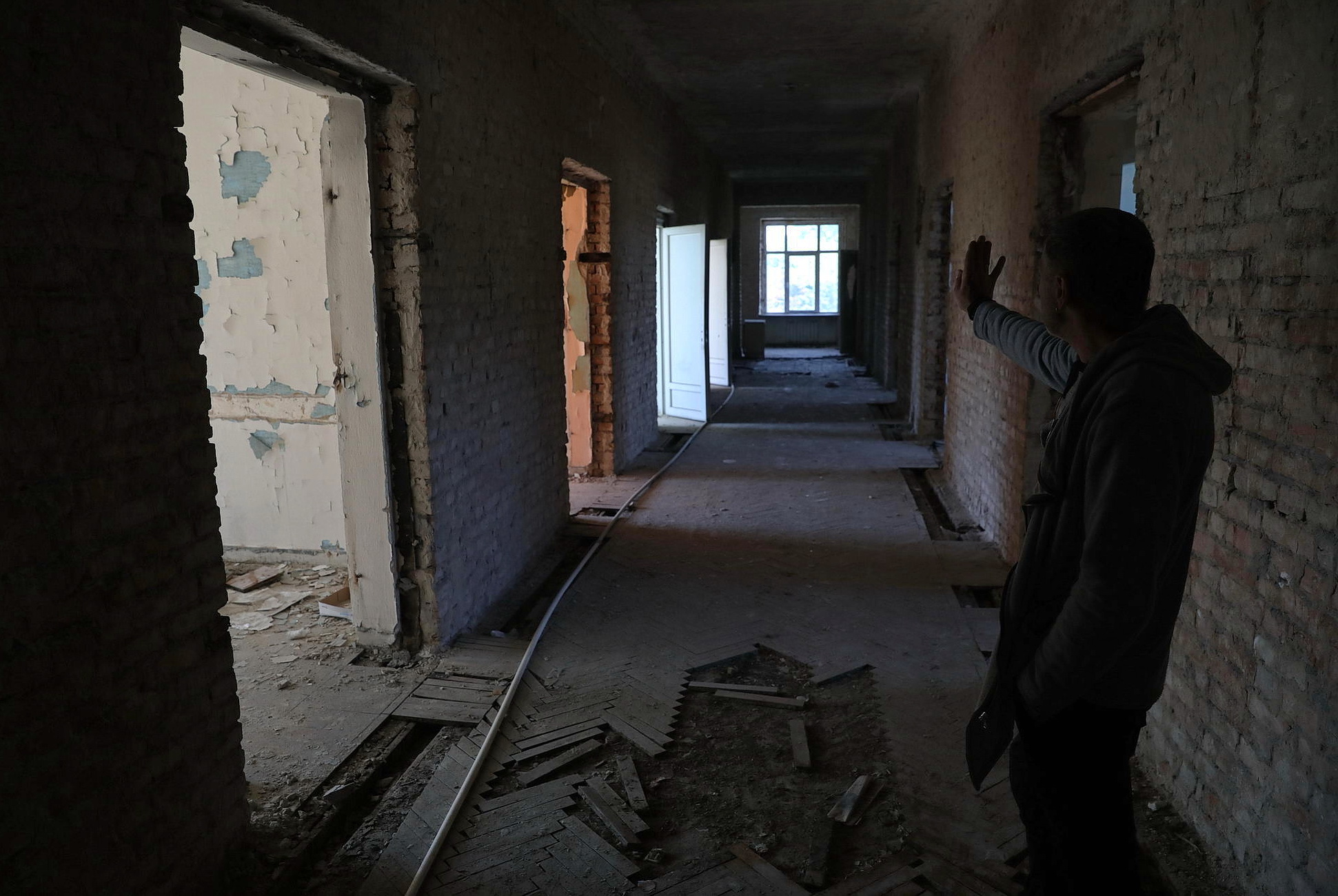 An employee of the Trade Unions House in Odesa shows the results of fire there on May 13, 2019. The 42 people were killed there by fire on May 2, 2014.