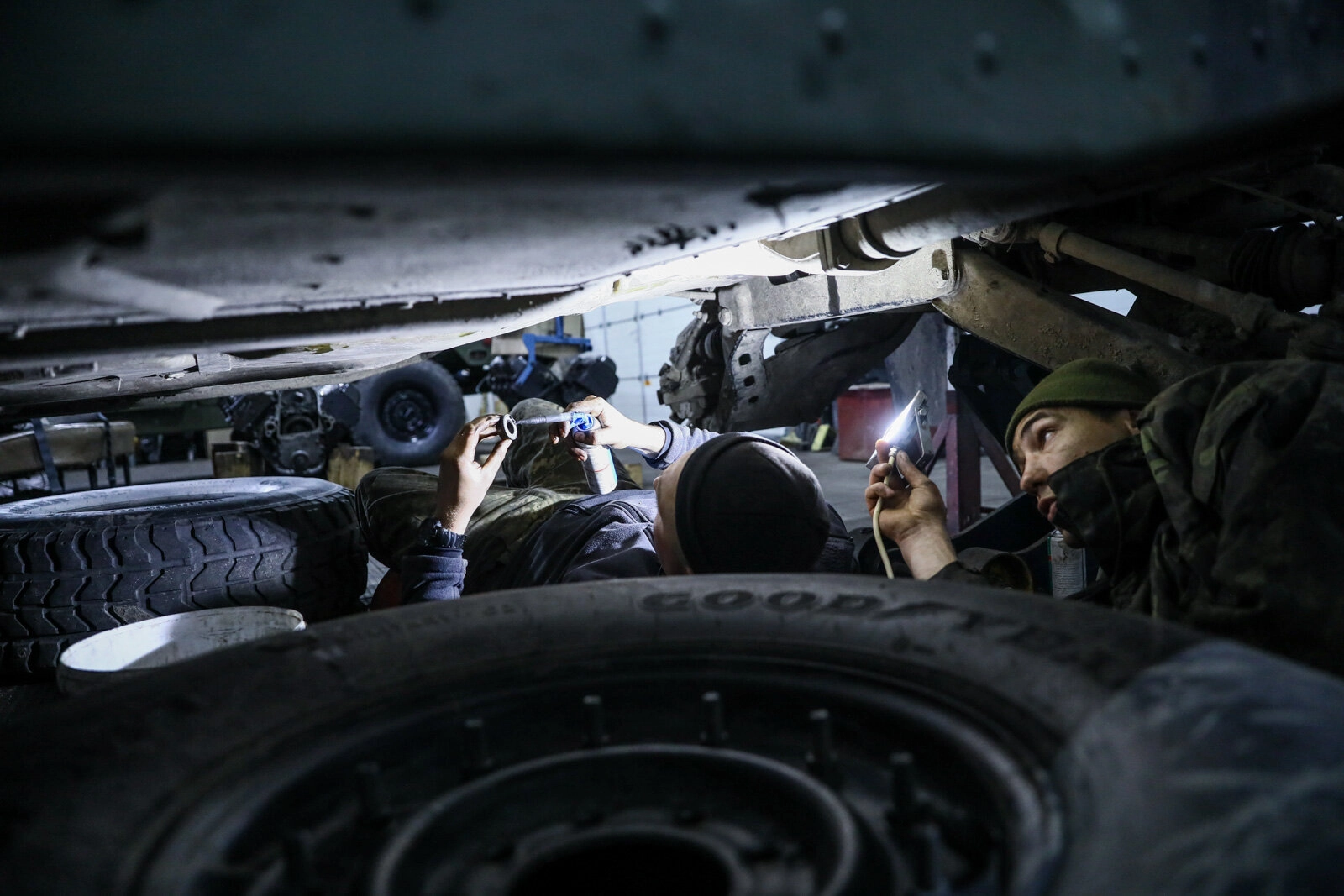 Technicians repair a Humvee vehicle at a Ukrainian army&#8217;s maintenance and overhaul workshop in the city of Zhytomyr on Nov. 20, 2020.