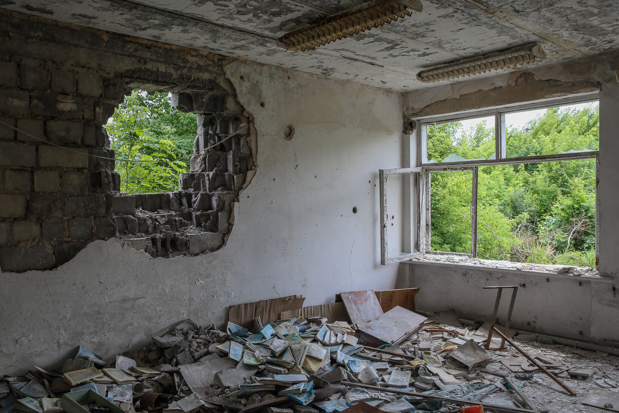 A devastated school library building in the town of Opytne, eastern Ukraine, pictured on June 12, 2019.