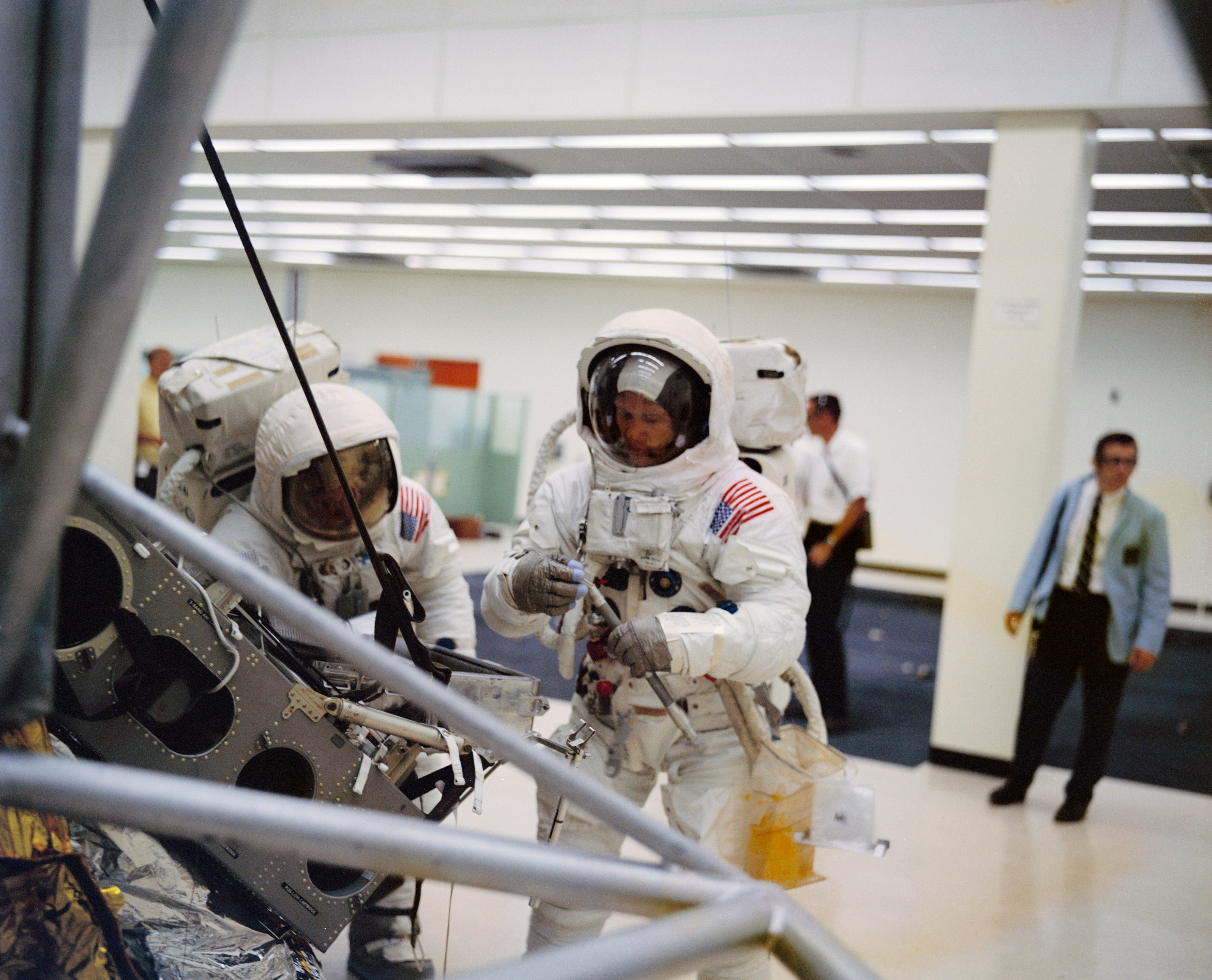 Astronauts Buzz Aldrin (L) and Neil Armstrong (R) practice extravehicular activities on May 18, 1969.