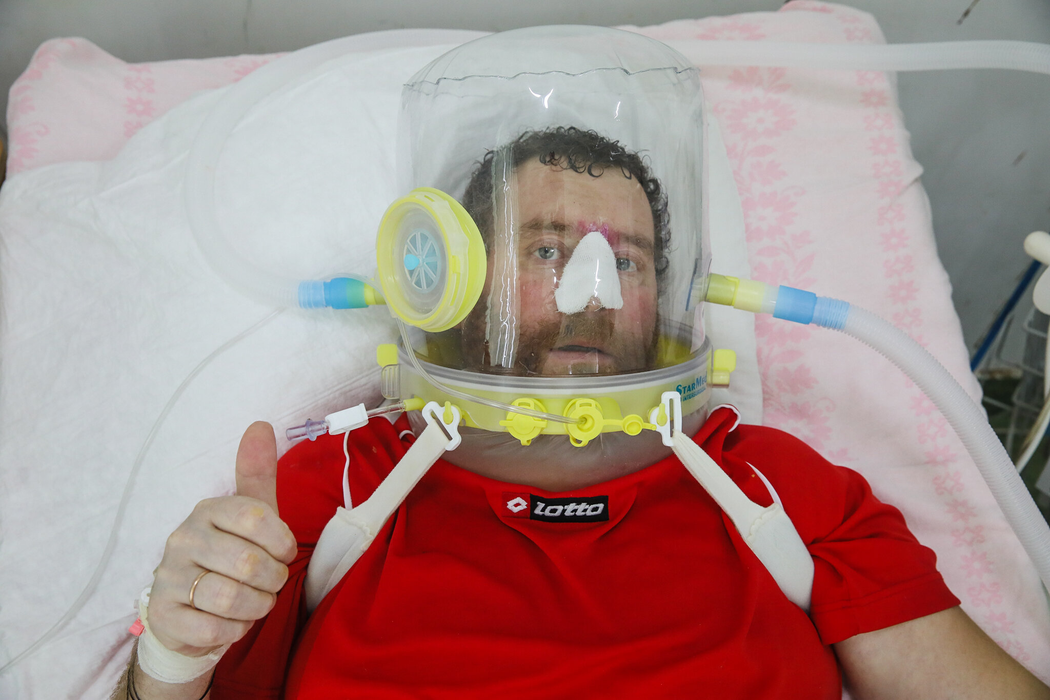 COVID-19 patient Vasyl wears a helmet supplying him with oxygen-enriched air at Kolomyia District Hospital in Ivano-Frankivsk Oblast on March 16, 2021.