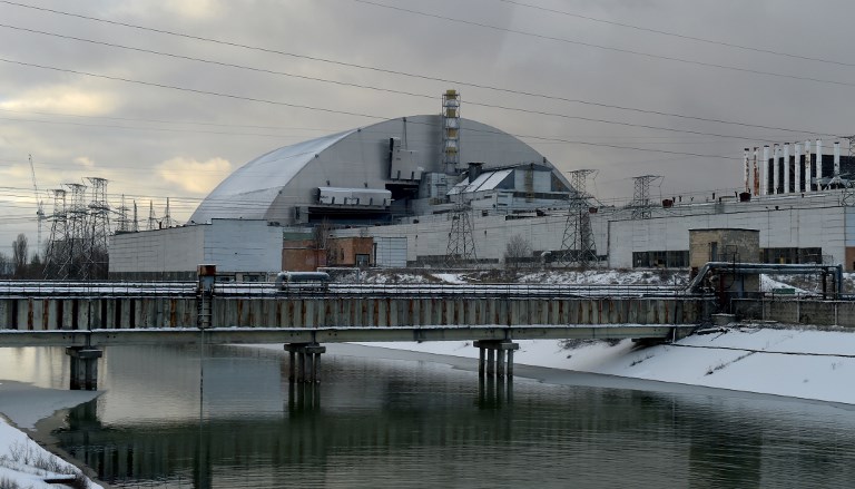 A picture shows Chernobyl&#8217;s New Safe Confinement covering the destroyed 4th block of the Chernobyl nuclear power plant after its installation was completed on November 29, 2016. 