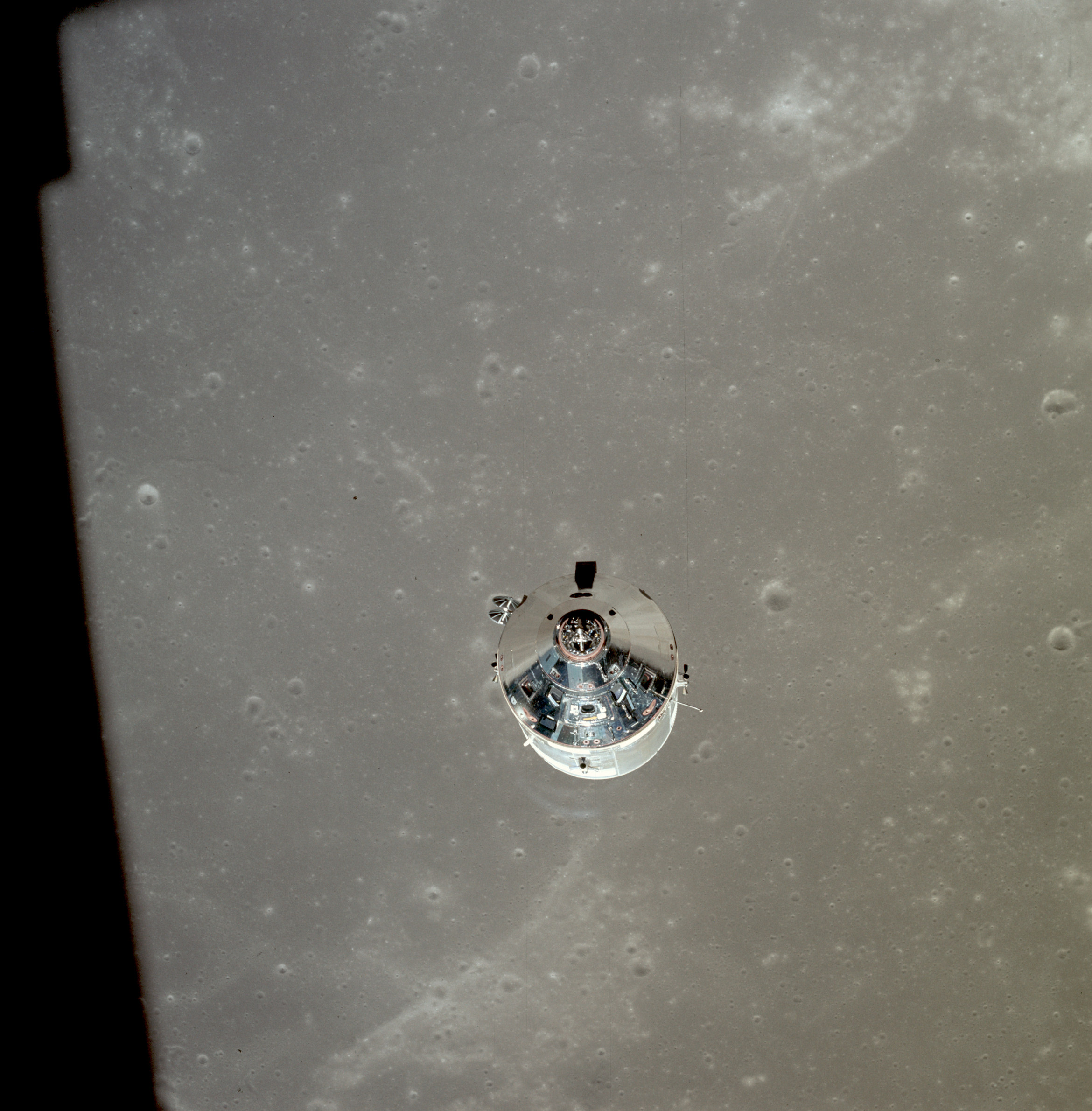The Apollo 11 command and service module orbits the Moon shortly after jettisoning the Eagle lunar module on July 20, 1969.