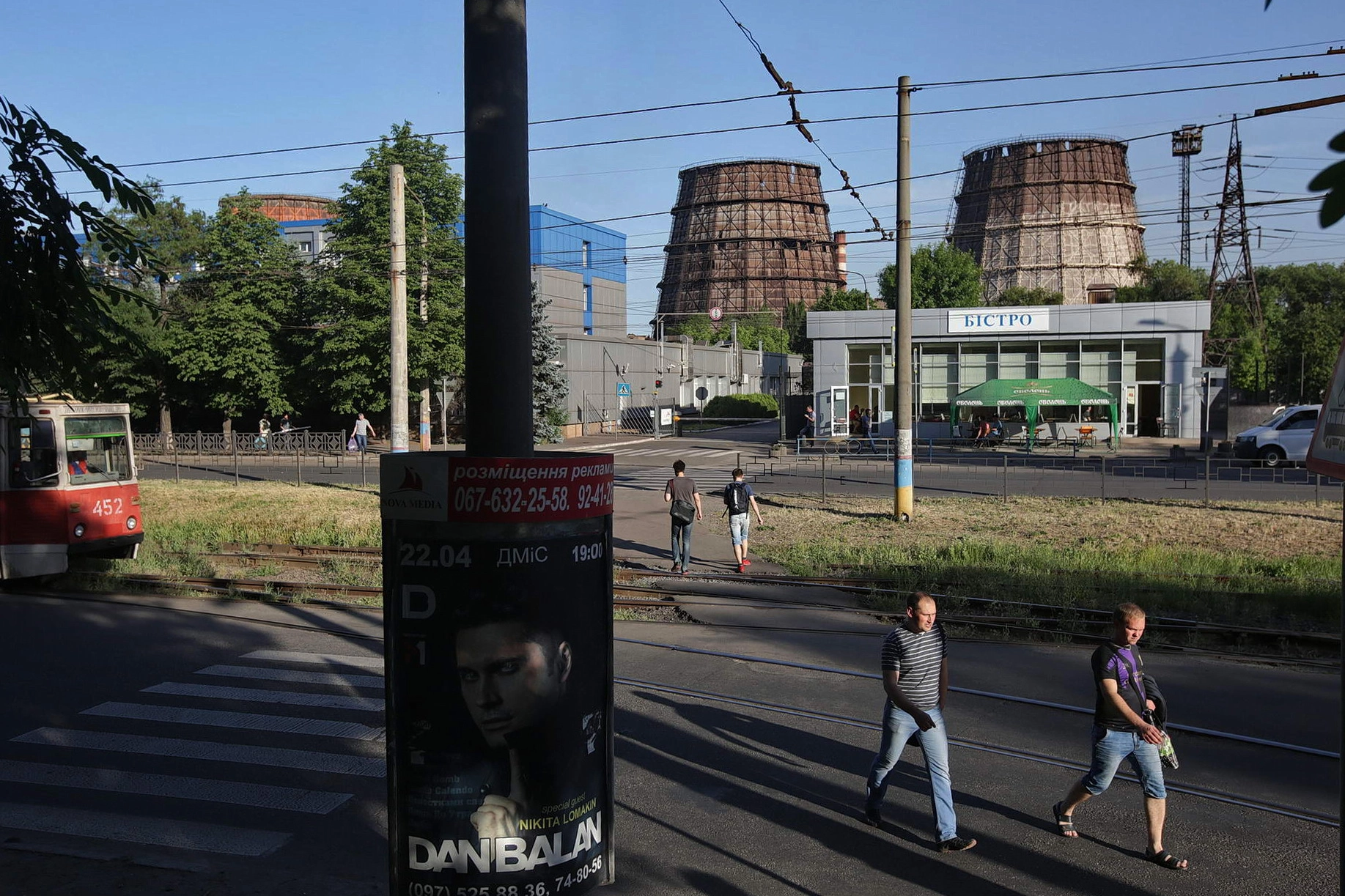 Workers leave the ArcelorMittal Kryvyi Rih steel plant at the end of their shift on June 7, 2018.