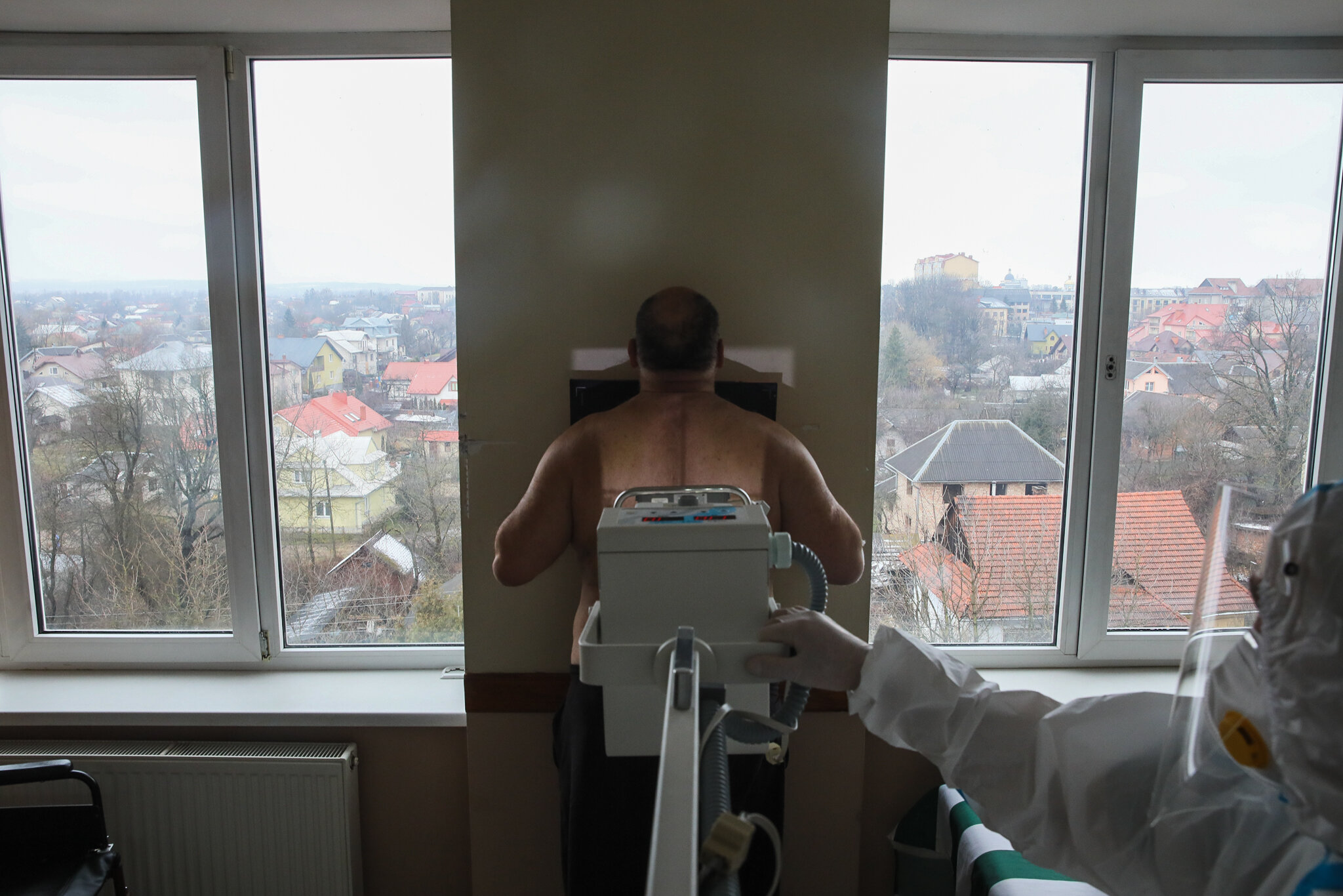 A COVID-19 patient undergoes a photofluorography screening to examine the development of lung damage in Kolomyia District Hospital in Ivano-Frankivsk Oblast on March 16, 2021.
