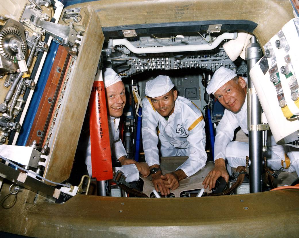 Astronauts Neil Armstrong (L), Michael Collins (C), and Buzz Aldrin (R) pose for the picture during a pre-mission practice on June 10, 1969.
