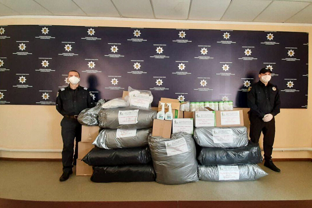 Police patrol officers are featured with aid they received from Philip Morris Ukraine. 