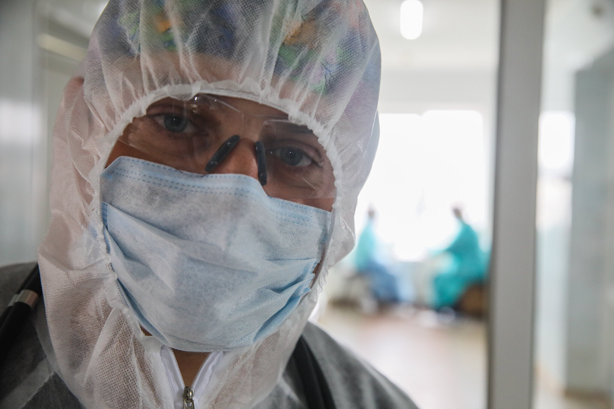 Vitaliy Yakubiyak, an anesthesiologist at Kolomyia District Hospital in Ivano-Frankivsk Oblast, stands in the hallway of intensive care unit for coronavirus patients on March 16, 2021.