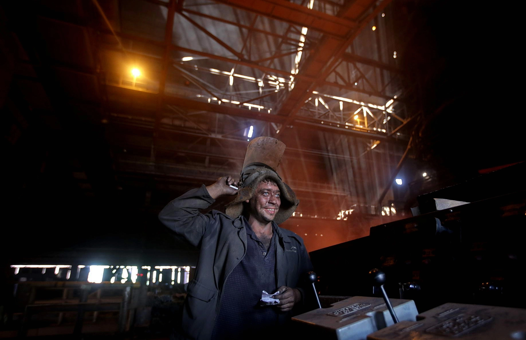 A worker at ArcelorMitttal Kryvyi Rih operates controls inside one of the steel mill&#8217;s blast furnaces. The factory has been rattled by strikes in recent months amid a push by the plant&#8217;s unions to raise pay. 