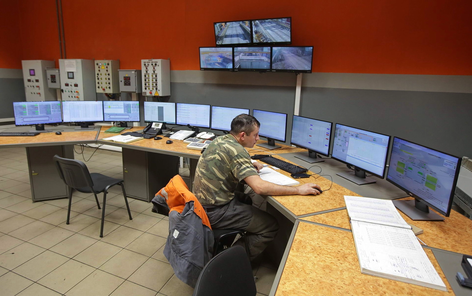 A worker oversees the operations of a blast furnace at ArcelorMittal Kryvyi Rih. 