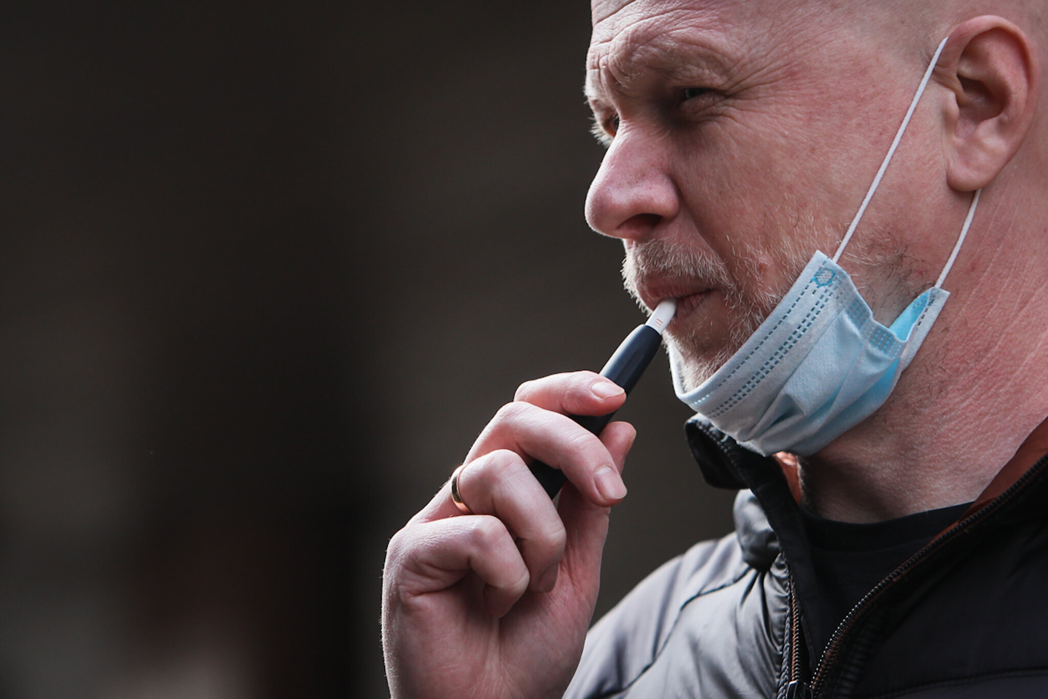A man is puffing his IQOS device on the streets of Kyiv during a national-wide lockdown in early May. 