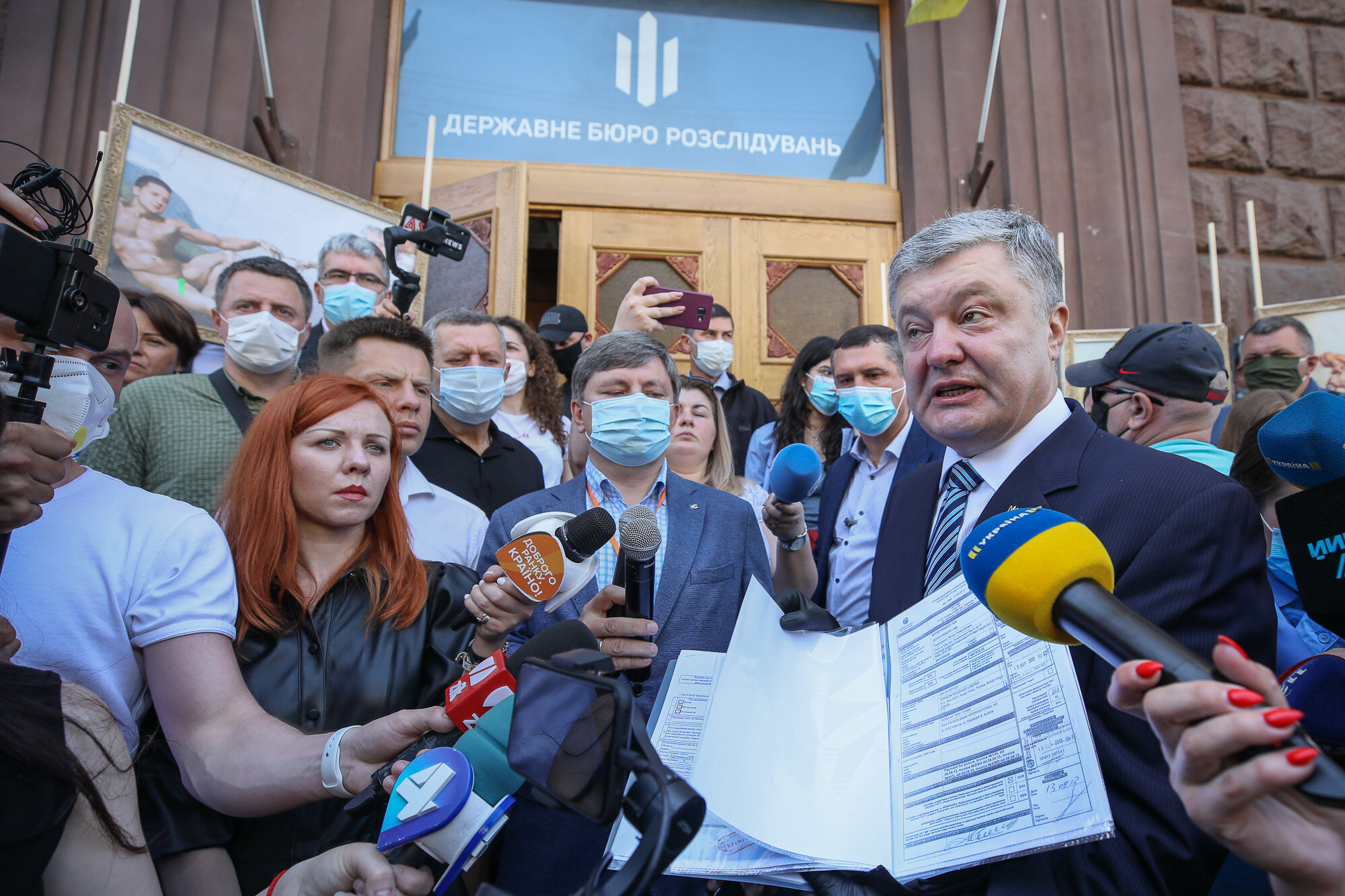 Petro Poroshenko speaks with journalists during a rally in his support in front of the State Investigation Bureau in downtown Kyiv on June 10, 2020.