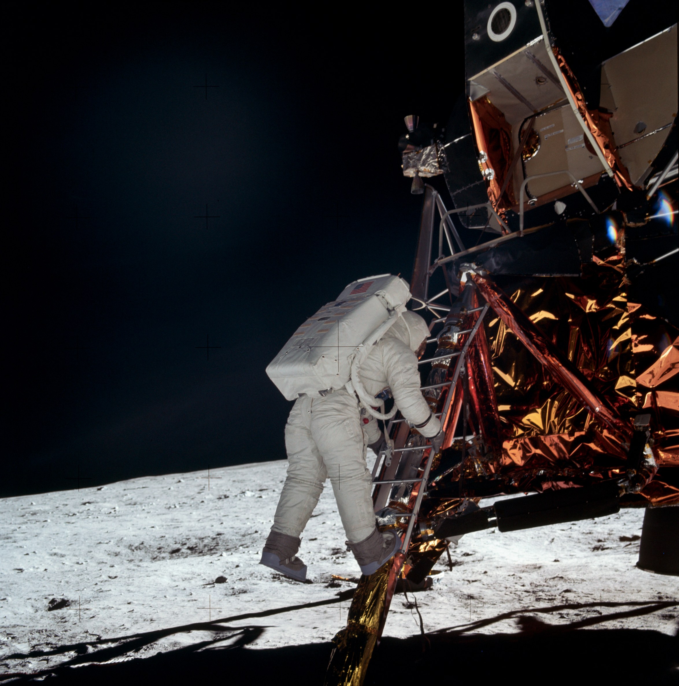 Astronaut Buzz Aldrin comes down the Eagle lunar module ladder during the extravehicular activity stage on the Moon surface on July 21, 1969.