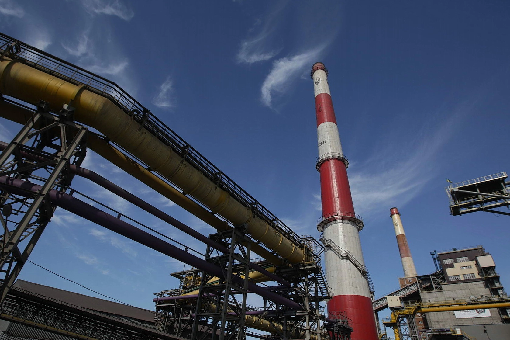 Smokestacks tower above a coking plant built in 2013 at ArcelorMittal Kryvyi Rih, constructed as a part of the company&#8217;s strategy to modernize the steel mill. Photo taken on June 7, 2018.