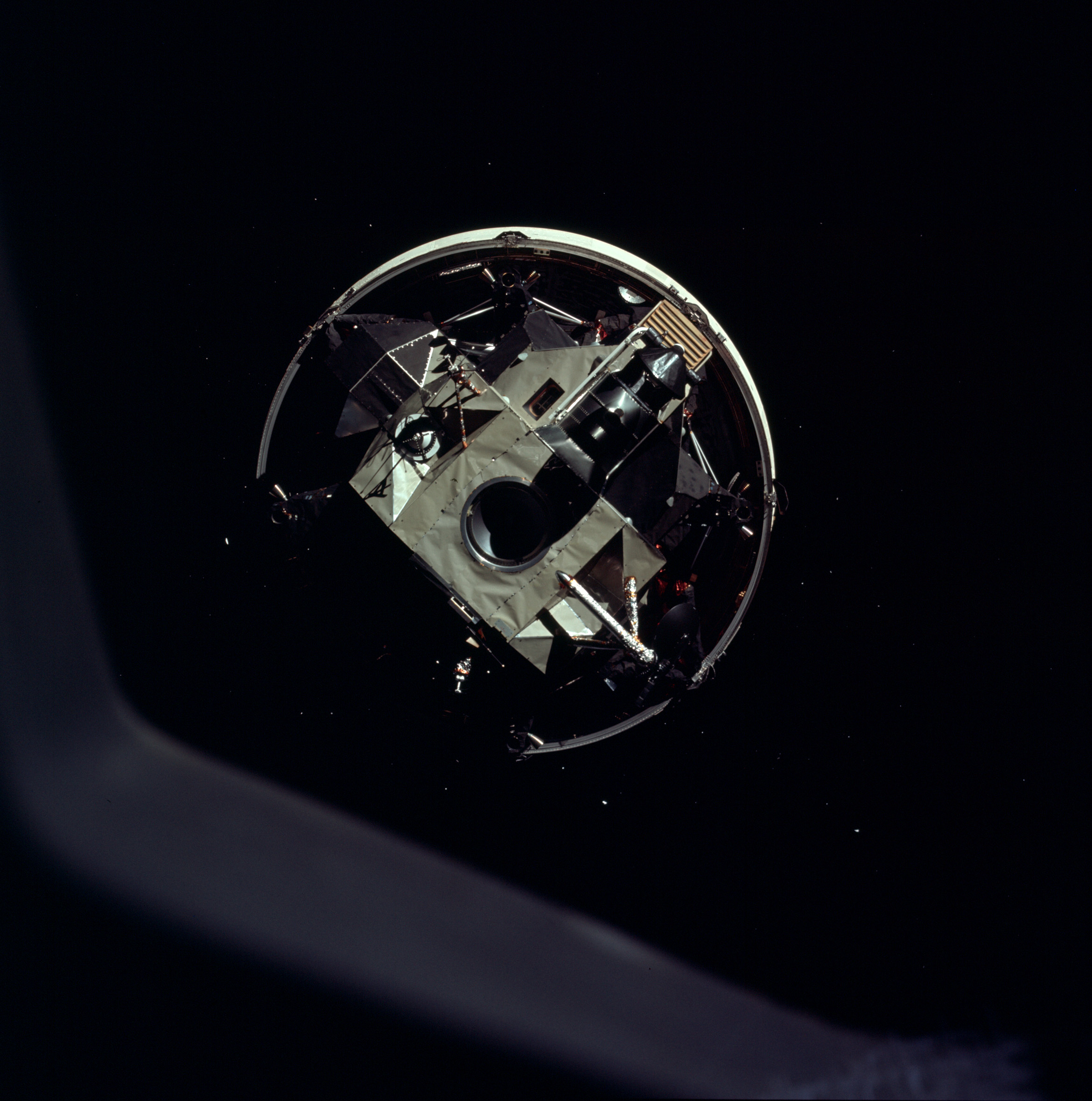 The Apollo 11 command and service module orbits the Moon shortly after jettisoning the Eagle lunar module on July 20, 1969.