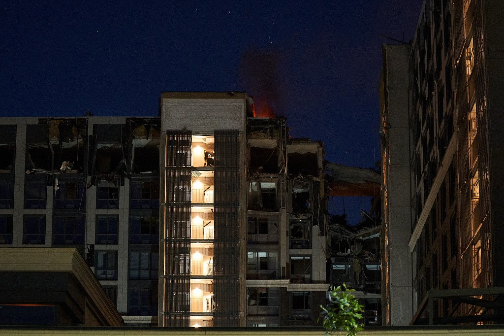 This photograph shows a residential building partially destroyed after missiles strike in Dnipro on July 28, 2023. Vitalii  Matokha / AFP