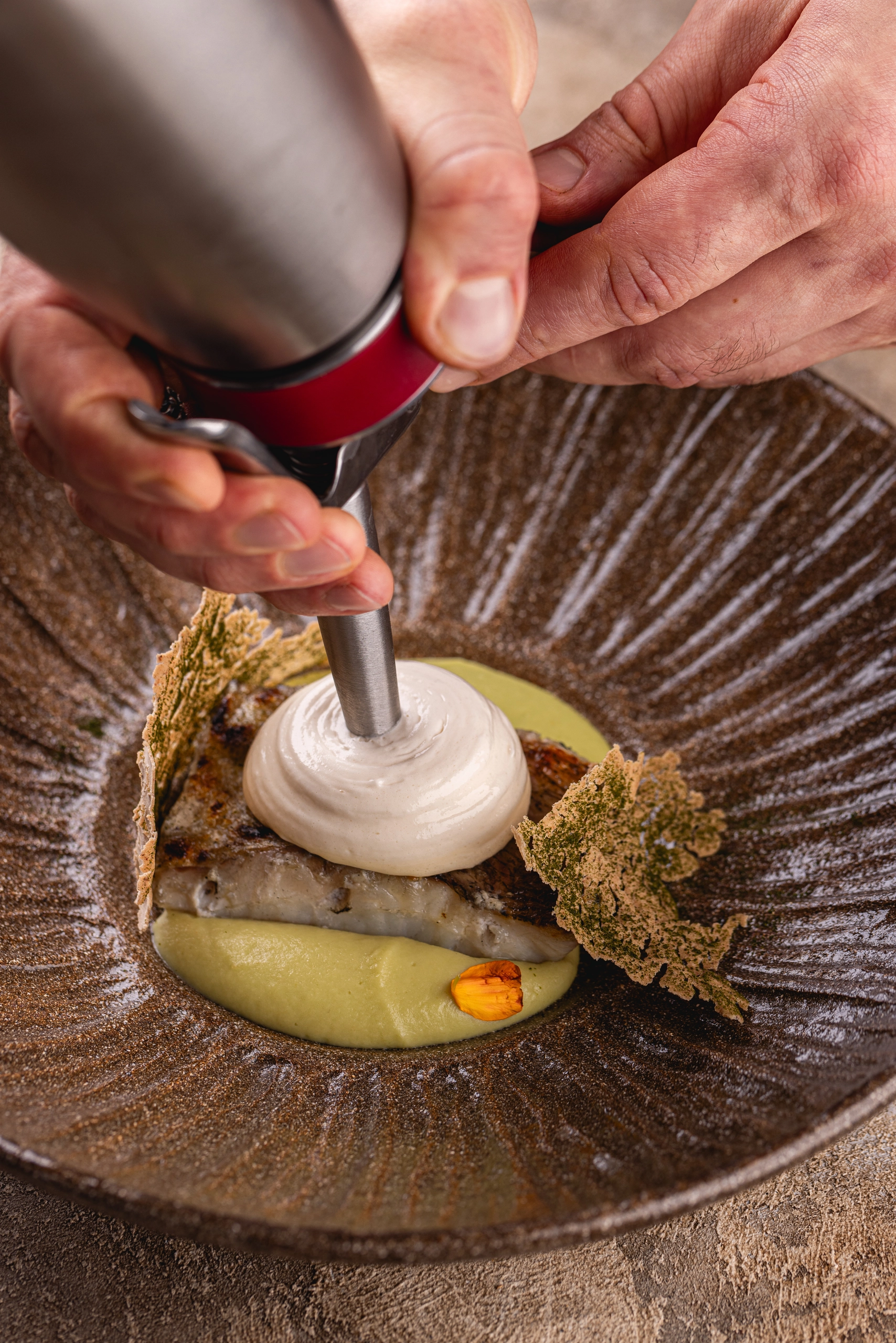 Pike perch fillet, apple and celery puree and lovage and Bernaise sauce with baked yeast