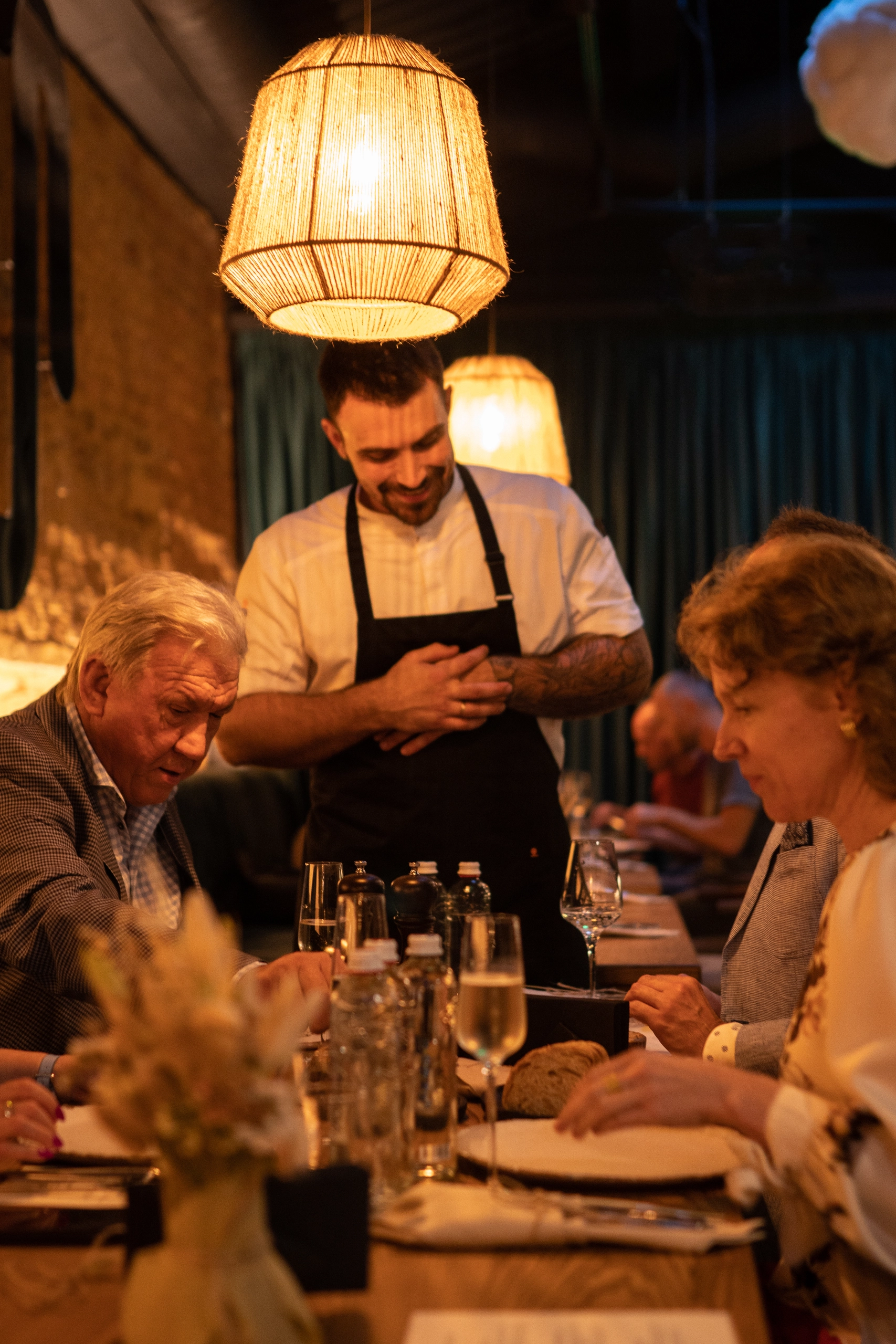 The head chef is presenting the dishes