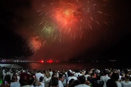 Fireworks, Weapons Light Up Skies as World Enters 2024