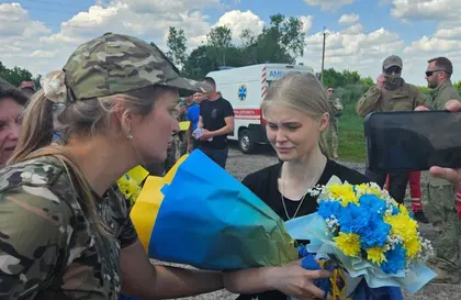WATCH: Coming Home, POWs Kiss Ukrainian Earth Again
