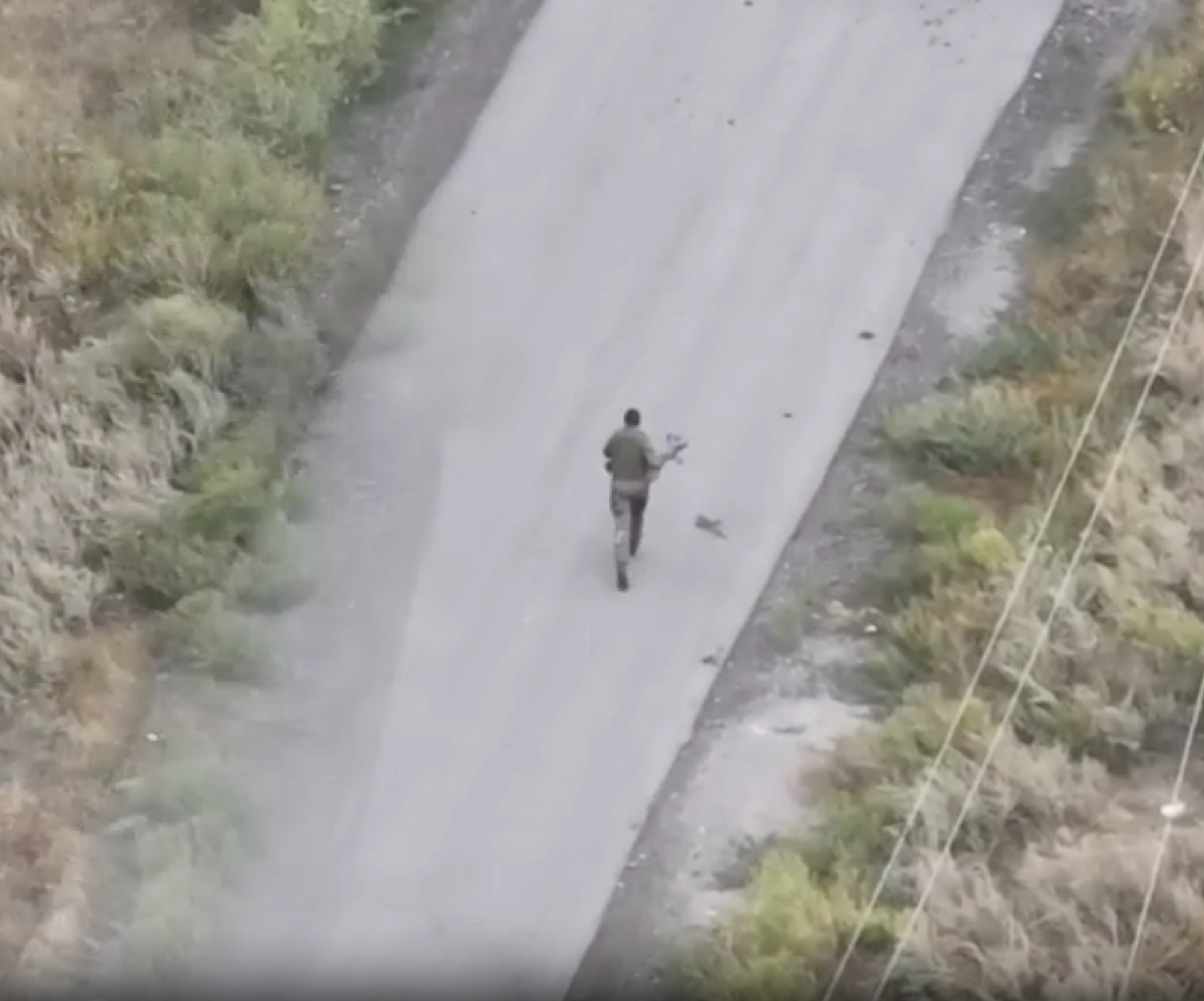 WATCH: Russian Soldier Catches and Runs with Ukrainian FPV Drone Until It Detonates in His Hands