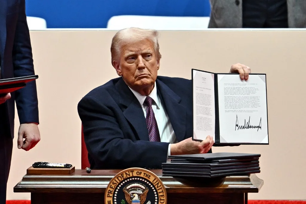 Trump Signs Flurry of Executive Orders on Day One, Tosses Sharpies Into Crowd