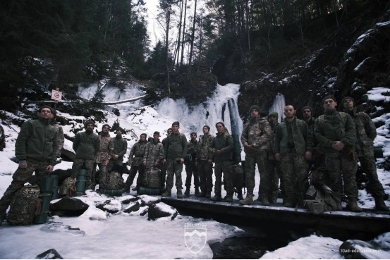 Soldiers hike in Carpathians during a unit morale-building event, 10th Mountain Brigade “Edelweiss.”