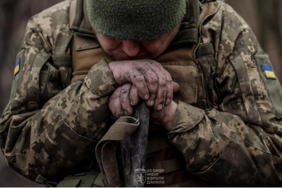 Soldier, 24th Mechanized Infantry, resting during training.