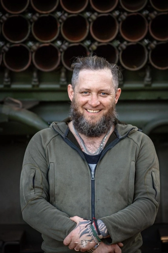 BM-21 crewman poses next to firing system, 68th Jaeger Brigade.