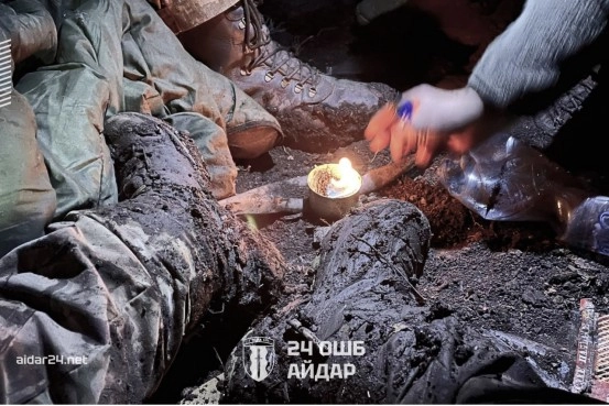 Infantrymen dry footwear, frontline position, 25th Assault Battalion “Aidar.”