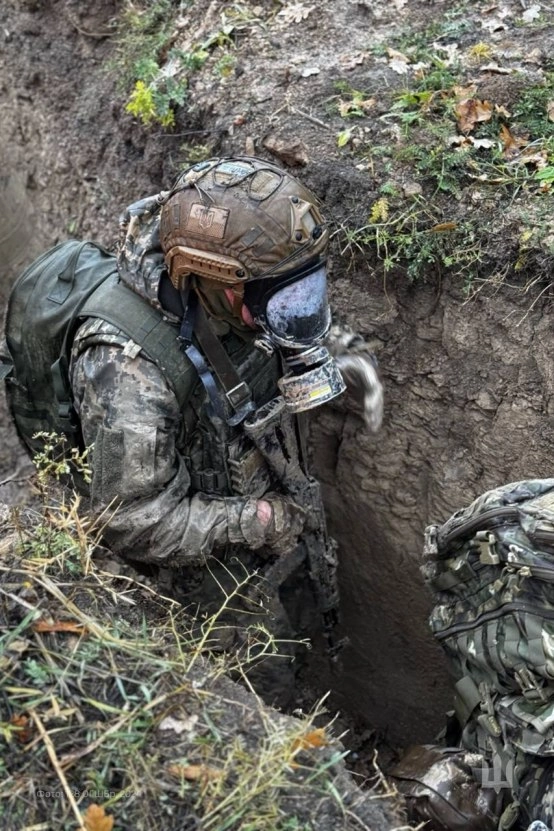Soldier trains trench assault, 128th Mountain Assault Brigade.