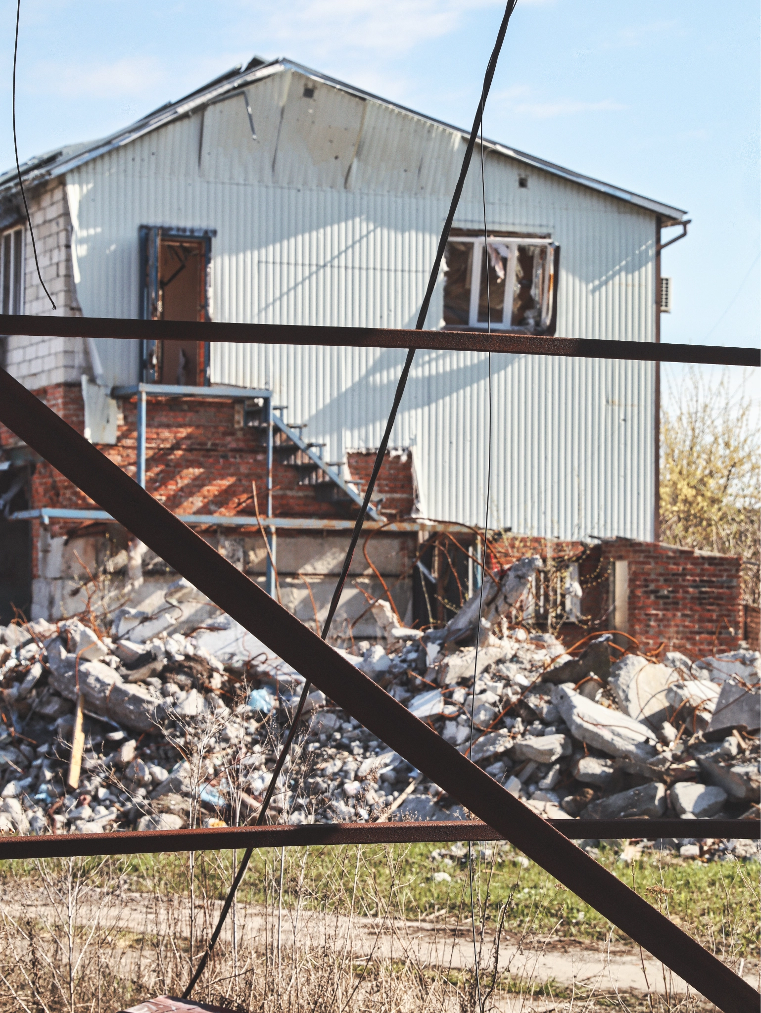 Buildings north of Kharkiv damaged by repeated Russian shelling, April 2026. (Photo by Korbinian Leo Kramer)