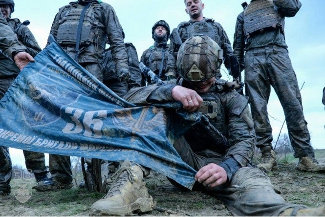 New Ukrainian Marine rests and shows emotion after completing the 36th Brigade’s grueling qualification course. (Photo: ua_navy / Instagram)