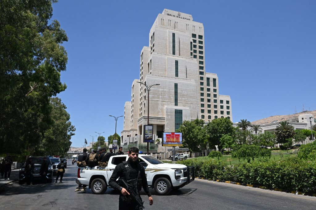 Bomb attacks in Damascus wound 18 as France’s Macron visits Syria